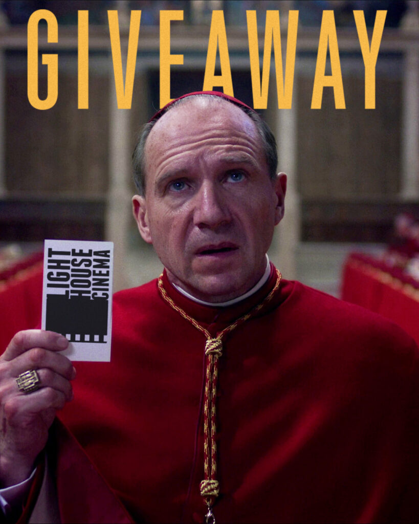 Ralph Finnes' character from the film 'Conclave' holding cinema tickets. Above him is the word "Giveaway" in a mock-Conclave style.
